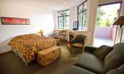 Affordable Studio in Whistler :: kitchen, deck, jetted tub Photographs